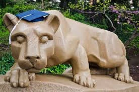 This is a photo of the Nittany Lion statue wearing a graduation cap. 