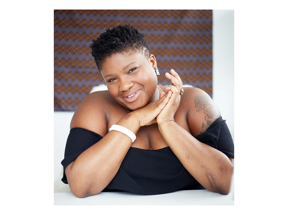 A woman posing and smiling 